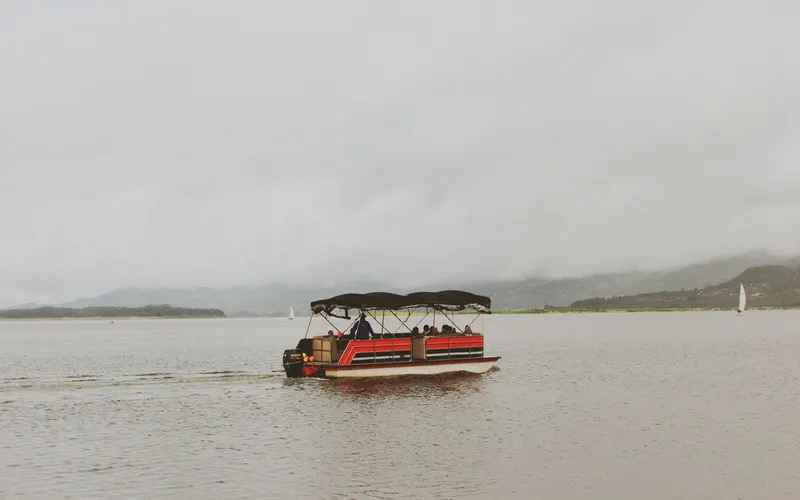 Pontoon boat cruising on a calm lake